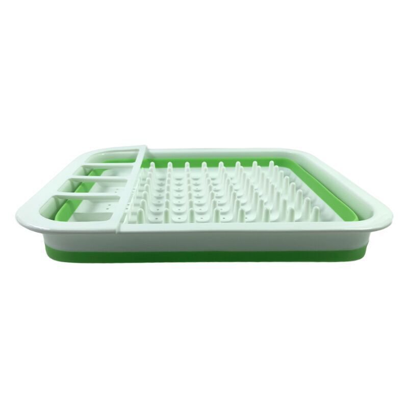 Green and white plastic tray with drainage holes on a white background
