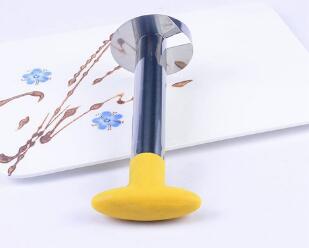 Yellow safety gate stopper on a white surface with decorative elements.