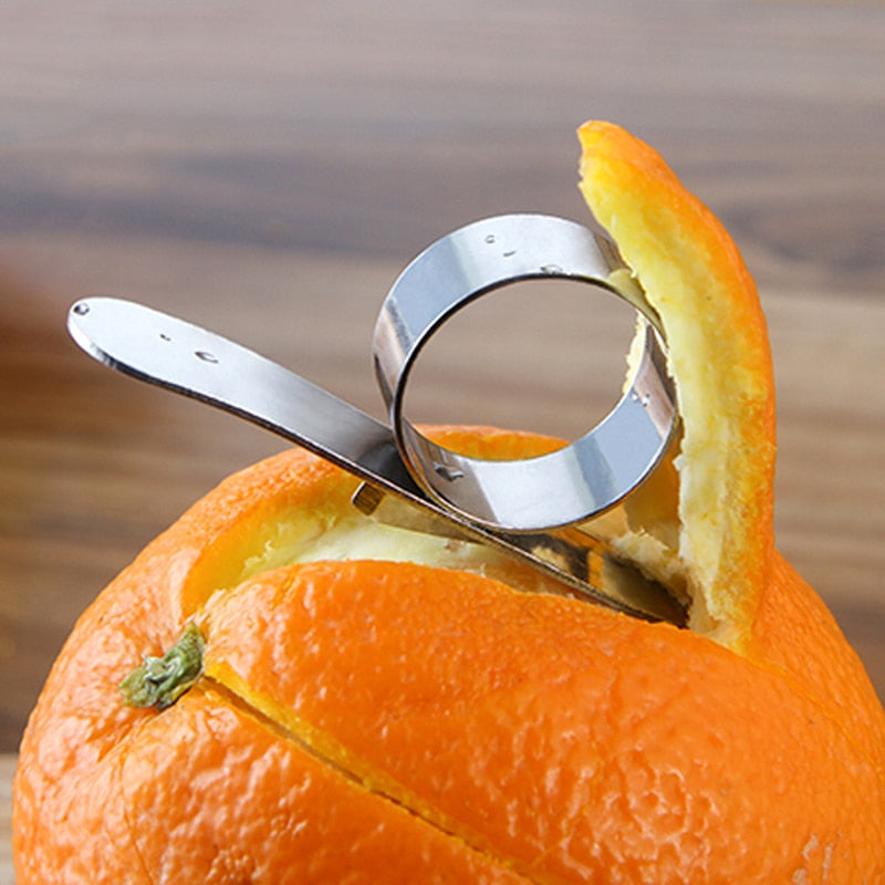 Silver ring on a peeled orange with a blurred background