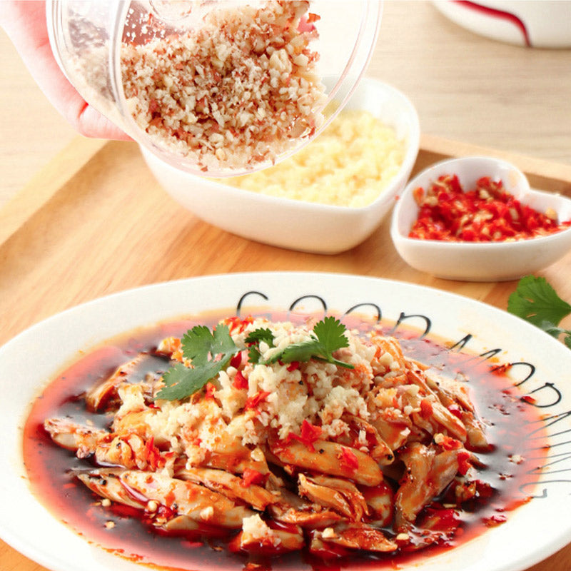 Plated dish of food with garnishes on a wooden table