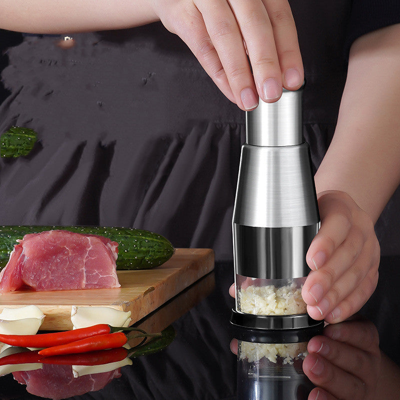 Person using a pepper grinder with a kitchen setting in the background